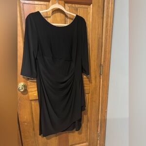 Lovely cocktail dress with subtle rhinestone beading at neck and sleeves.